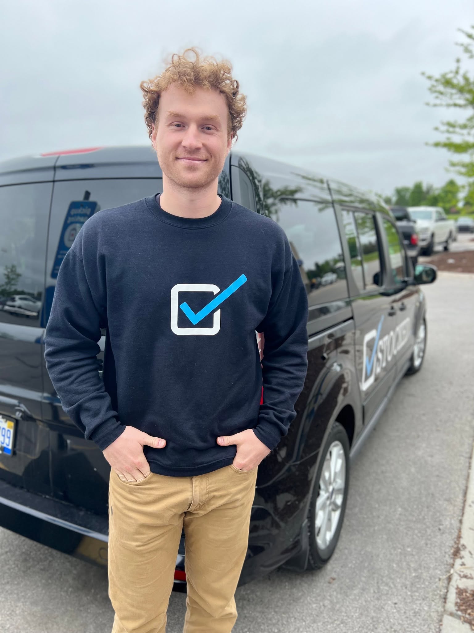 A Stocked team member with a delivery van